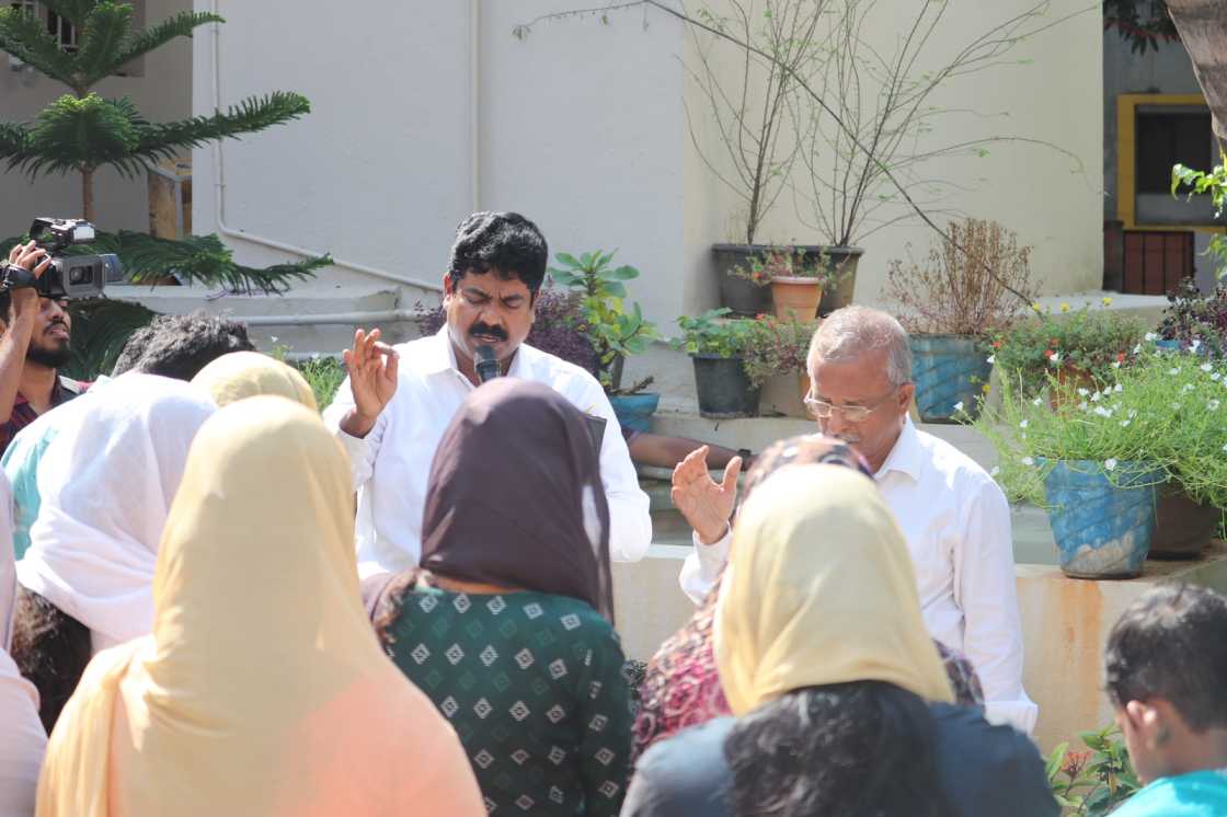 water baptism given by pastor to church believer