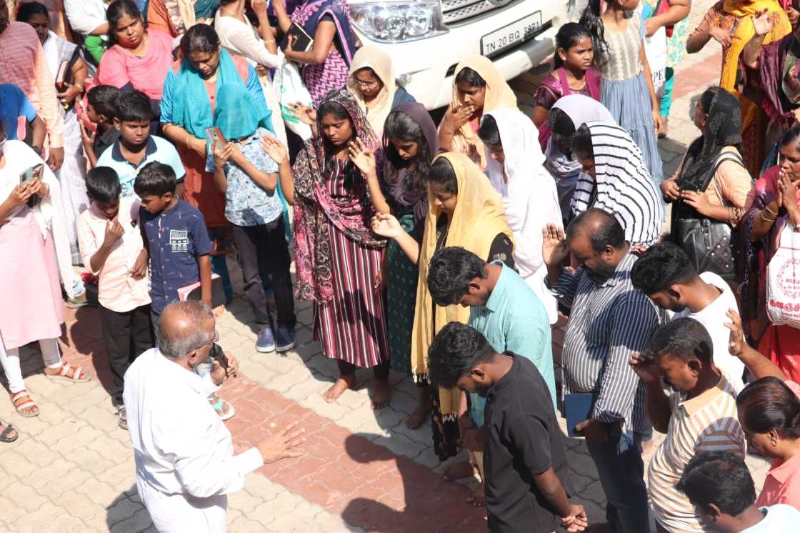 water baptism given by pastor to church believer