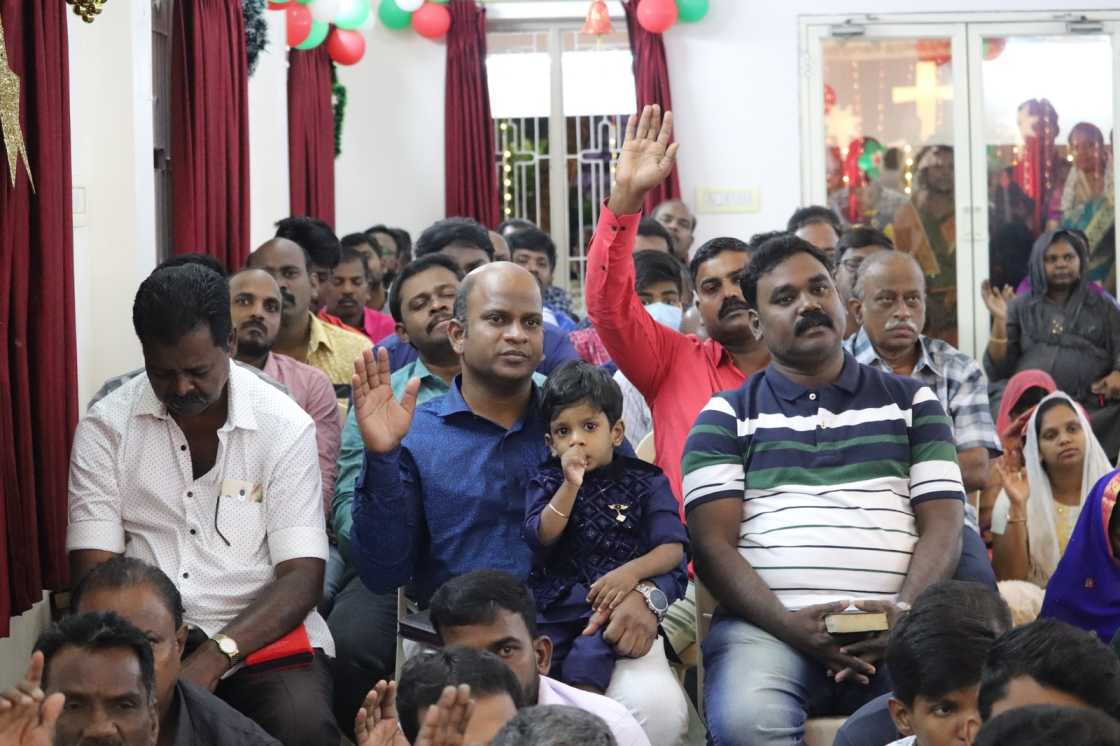 water baptism given by pastor to church believer